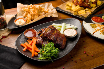 Barbecue pork ribs with sauce on wooden table