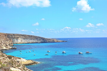 View of the most famous sea place of Lampedusa, Rabbits Beach or Conigli island. LAMPEDUSA, ITALY - AUGUST, 2019