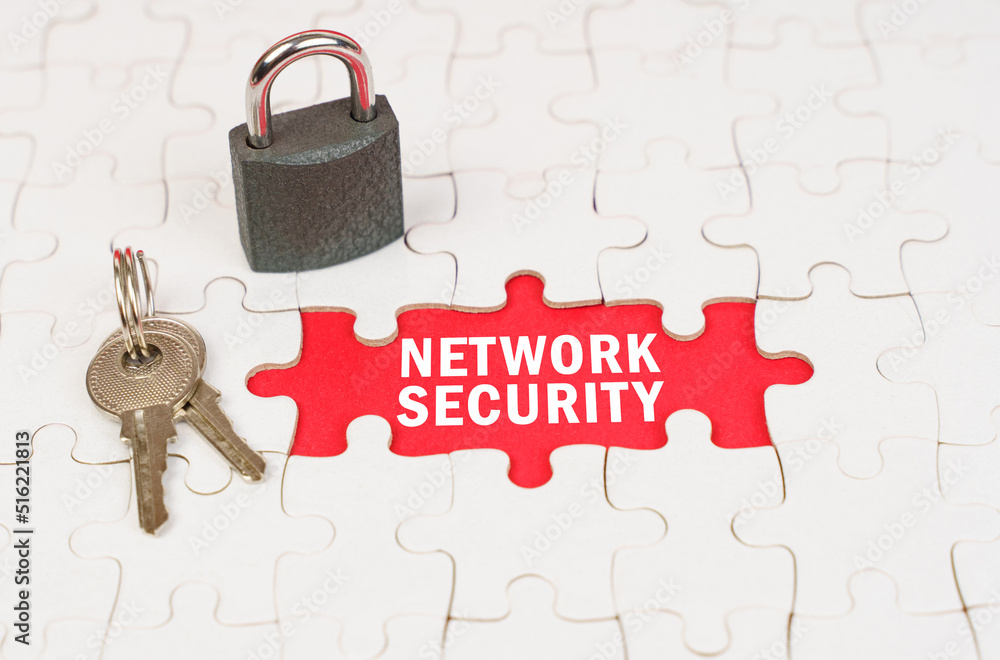 Aufkleber on puzzles there is a lock and keys, on a red surface there is an inscription - network security