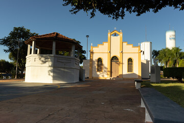 Fototapeta premium Chapel of Talhado district in São José do Rio Preto with gazebo and trees in the square