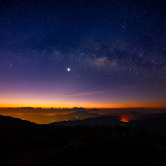 Milky way with brightest Venus in 2022 above Doi Inthanon National park at dawn,  Chiang mai, Thailand.