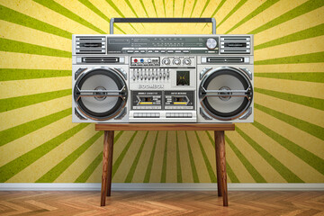 Retro ghetto blaster boombox, radio and audio tape recorder on vintage background.