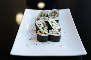 Japanese sushi on a white plate.