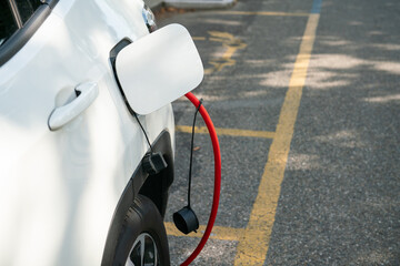 electric vehicle charging, connected with the red cable to the electrical control unit. hybrid car...