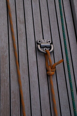 Close-up of a sailboat cable clip on the deck