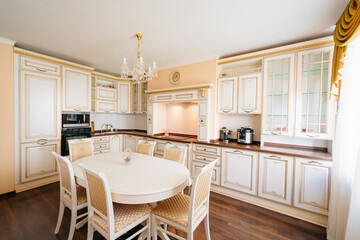 The interior of a large and spacious kitchen-living room in a classic style. 