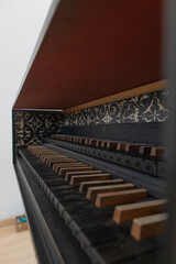 baroque style harpishcord, old renaissance classic piano with black wooden keys