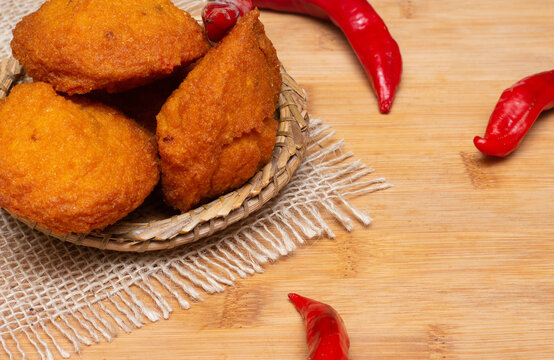 typical food from Bahia called acarajé surrounded by red peppers