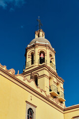 Fototapeta na wymiar Campanario del convento de la Cruz en el centro historico coloial de queretaro