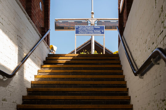 Hampshire, England, UK. 2022. Flight of stairs for railway passengers to climb to reach the platform at Micheldever station.