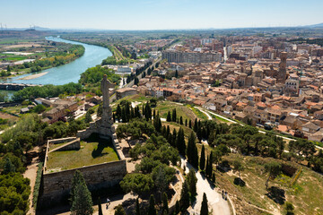 Scenic aerial view of Tudela cityscape on Ebro river from Cerro del Castillo with Monument to...