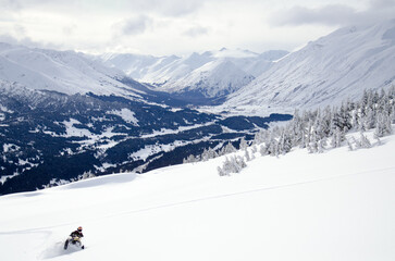 Alaska snowmachine rider in the backcountry 