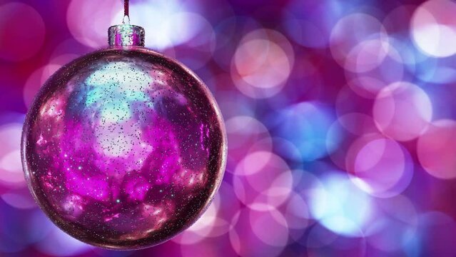 Realistic looping 3D animation of the hanging spinning glossy pink Christmas ball covered with shining glitter against beautiful bokeh lights rendered in UHD with a lot of useful copy-space