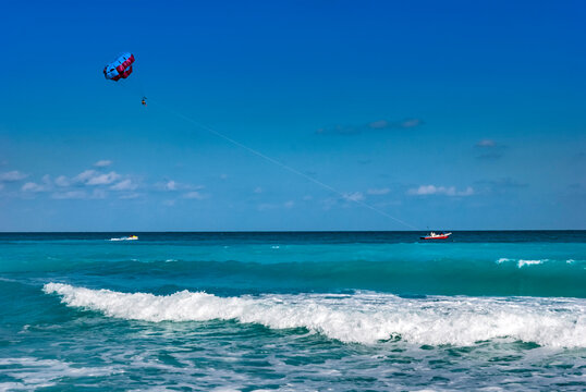 Tourists parasailing in Canaun, Mexico
