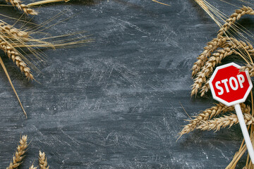 Stop on the import and export of wheat.Wheat ears and stop sign on black chalk board...