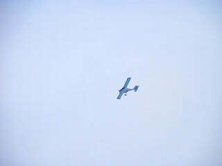 Flight Design CTSW. Zoom photo of small propeller airplane landing to small airport