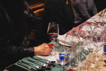 drinking a glass of red wine