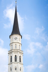 View of the Clock Tower of St. Michael's Church in Vienna against a blue sky