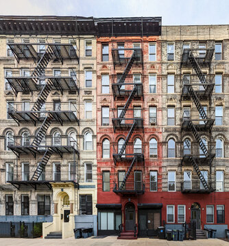 Exterior view of old apartment buildings with fire escapes in the East Village neighborhood of New York City