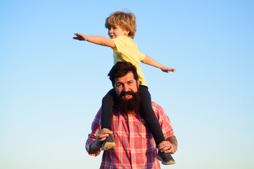 Happy family. Child son hugging his father against sky. Family travel vacation, father's day. Happy...