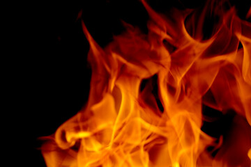 Fototapeta premium Abstract blur of Fire flames on black background. Burning power.