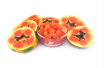 Sliced papaya fruit in glass bowl and isolated on white background.