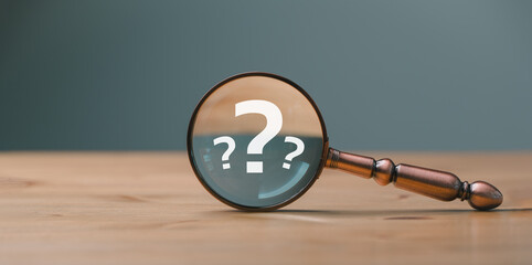 close up magnifier glass with question mark, concept of finding or searching for idea, search for...