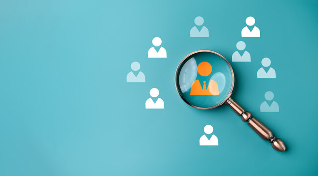 HRM or  Human Resource Management, Magnifier glass focus to manager icon which is among staff icons for human development recruitment leadership and customer target group concept.
