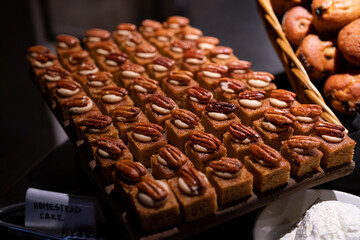 small cakes on plate with walnut on top