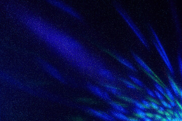 On a dark blue gradient background in fine grain, large and small multi-colored glare of light