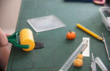 Boy is playing polymer clay