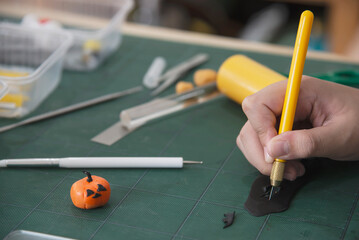 Boy is playing polymer clay