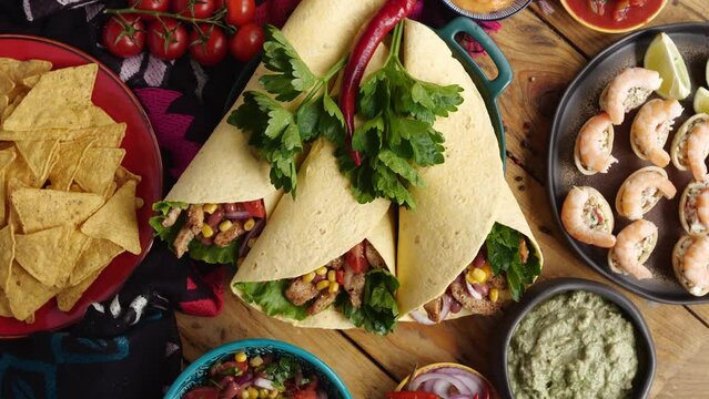 Mexican burritos are small and simple, often with meat, refried beans, and a sprinkling of cheese