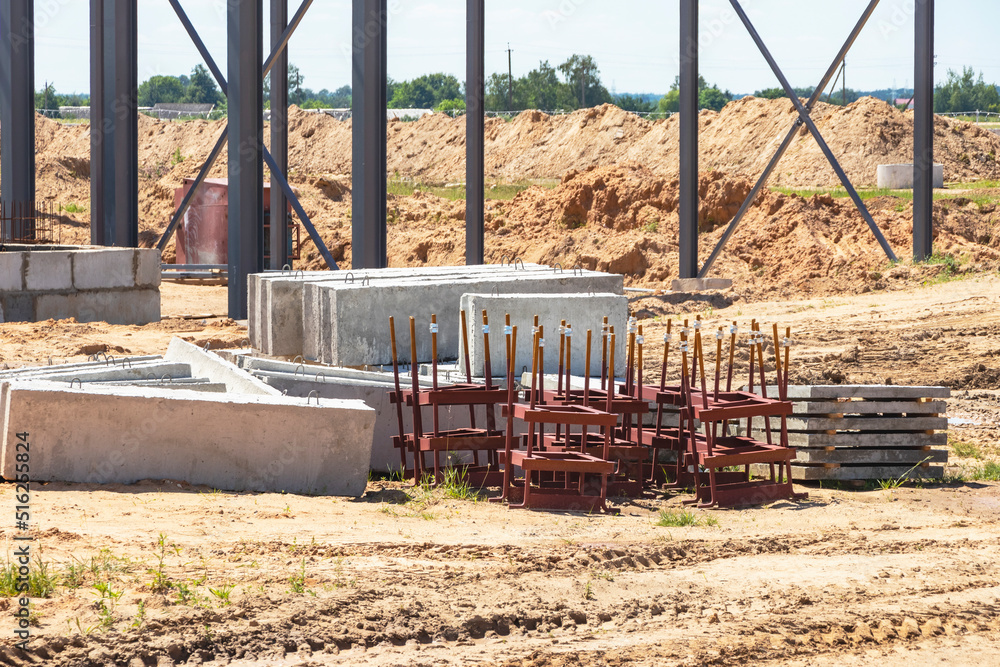 Poster building materials at a construction site. prepared materials and embedded parts for foundations at 