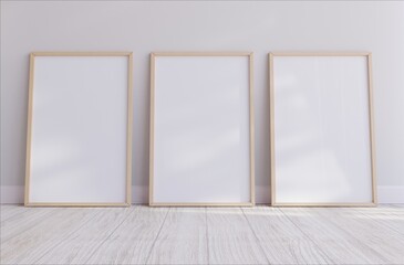 Wooden three vertical frame mockup on wooden floor with white background Minimalist home. Boho style. 3D illustrations.