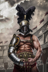 Shot of muscular gladiator dressed in armor and helmet posing showing his strength in arena.