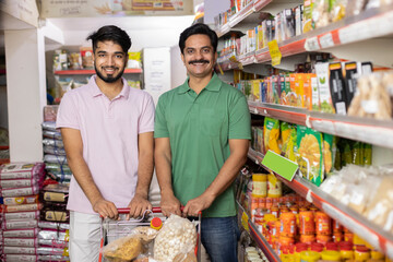 Father and son at supermarket.