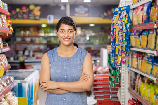 Woman in grocery aisle of supermarket