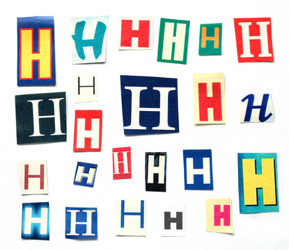 letter H, cut from a colorful newspaper