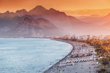 Sunset HDR effect view of scenic and popular Konyaalti beach in Antalya resort town. Majestic...