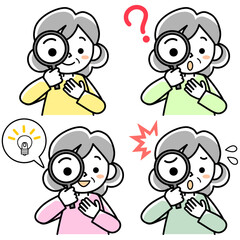 虫メガネをのぞくシニア女性の上半身