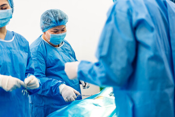 Professional anesthesiologist doctor medical team and assistant preparing patient to gynecological...