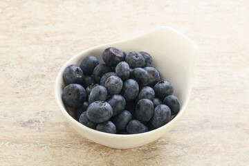 Sweet ripe blueberry heap in the bowl