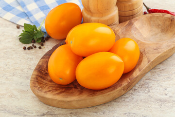 Sweet ripe yellow tomato in the bowl