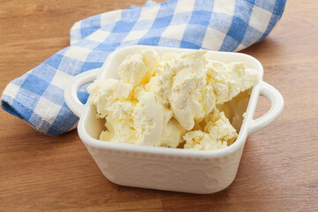 Italian soft mascarpone cheese in the bowl