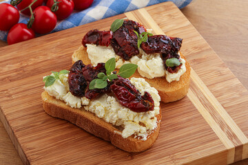 Bruschetta with soft cheese and tomato