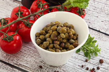 Marinated green capers in the bowl