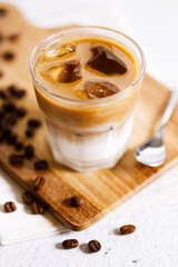 Iced Latte Coffee on white marble table.