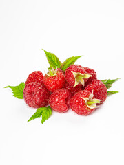 Ripe raspberries with leaves isolated on white background