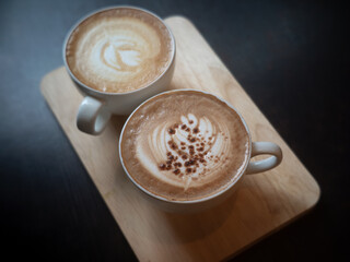 latte coffee cup and Mocha coffee cup on wood tray